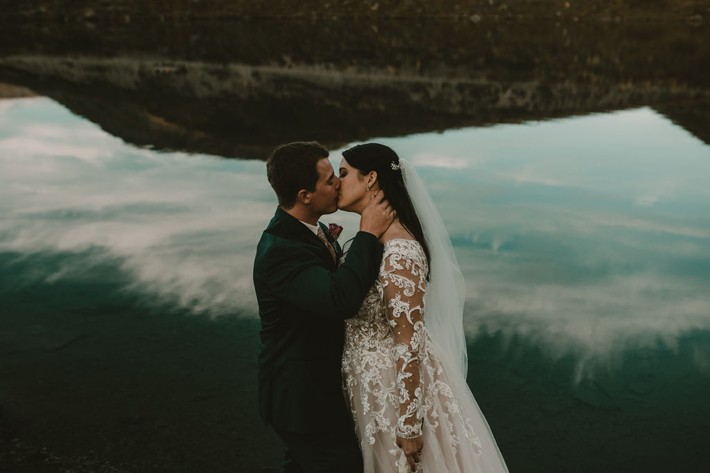 couple kissing during elopement in Alaska