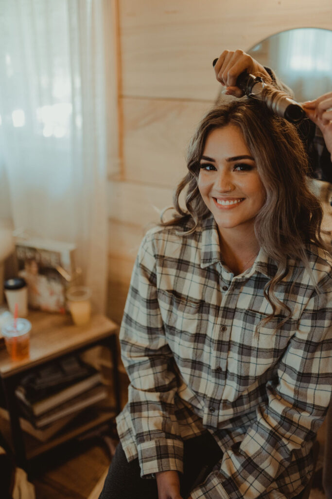 bride getting ready for her rustic modern wedding