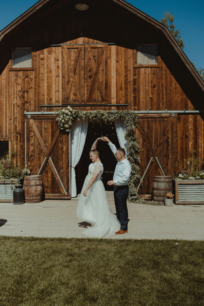 groom and groomsman laughing