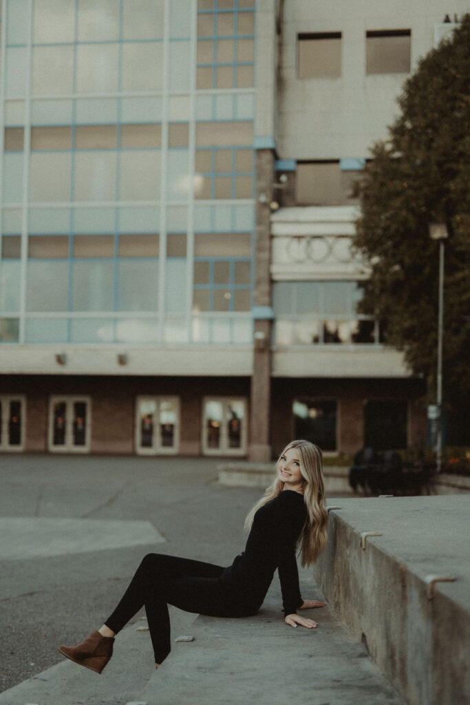 girl sitting during her senior portrait session