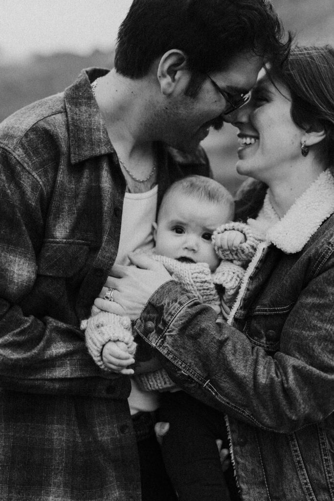 couple holding their baby