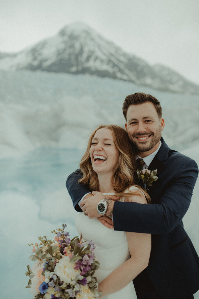bride and groom laughing with each other
