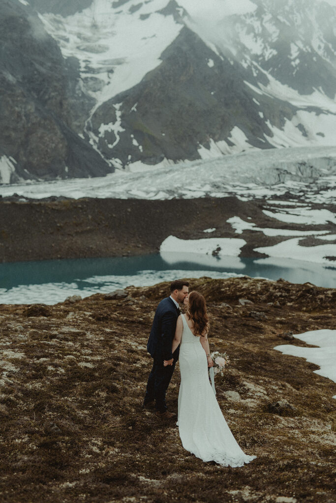 bride and groom kissing after their elopement ceremony