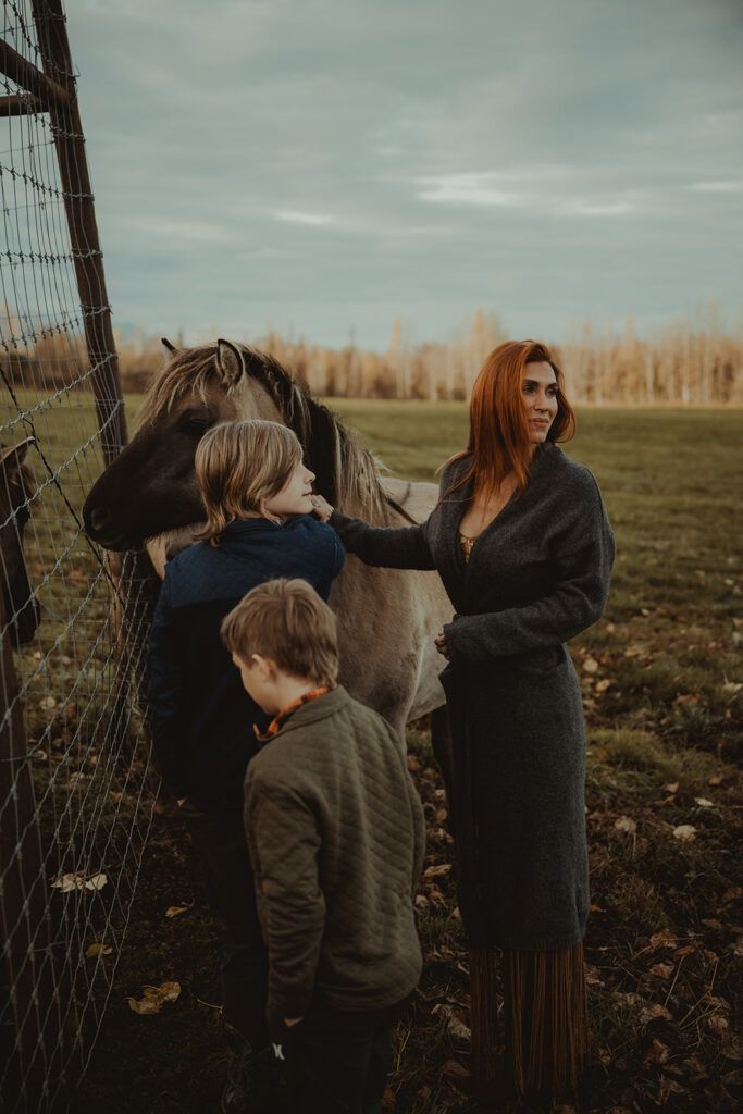 happy family at their playful family session in a ranch in alaska