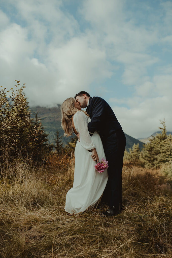 picture of the newly eloped couple kissing