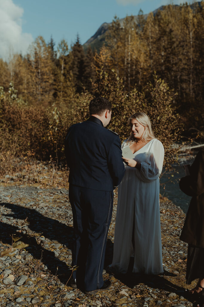 bride and groom holding hands during their ceremony