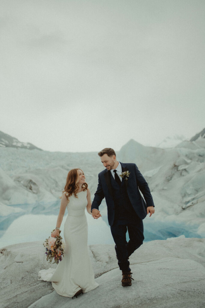 Couple walking on a glacier