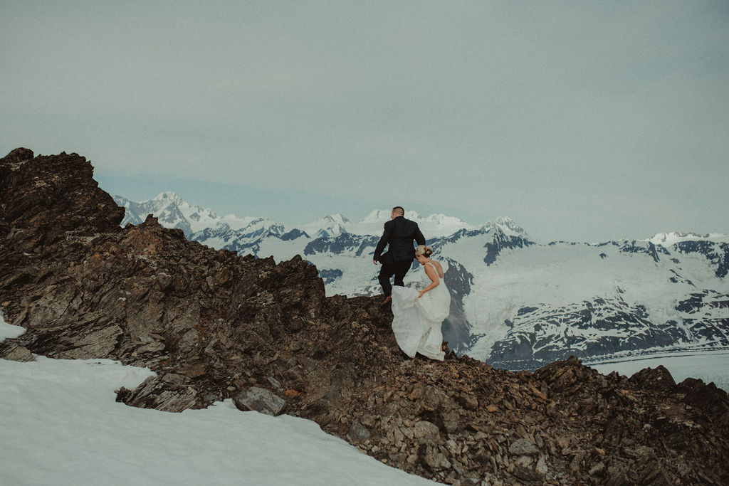 couple walking the mountains during outdoor wedding
