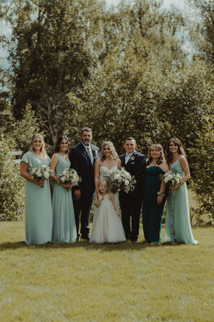 bride with her family at the rustic modern wedding