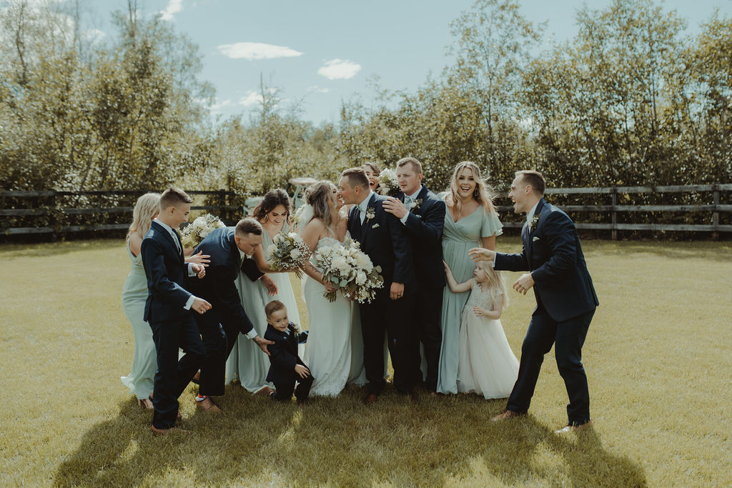 couple and their friends at the rustic modern wedding