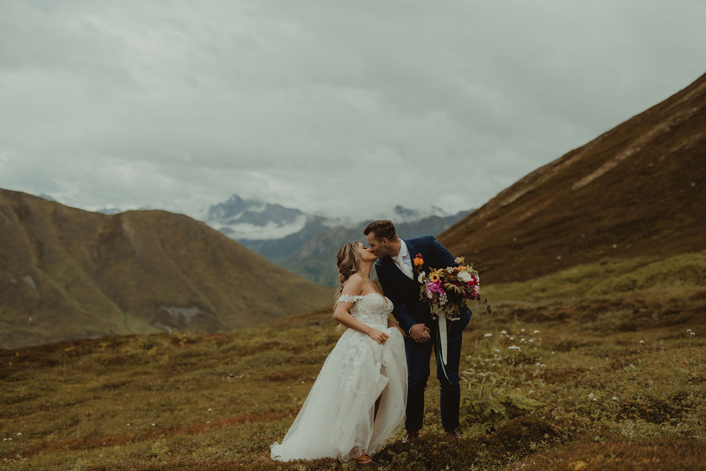 mountain top elopement with colorful florals