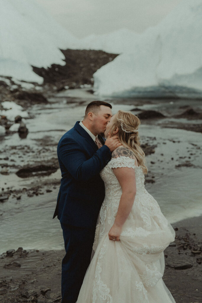 couple kissing at matanuska glacier at their epic alaskan elopement 