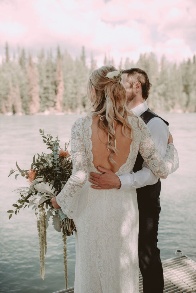 bride and groom hugging at their alaska elopement