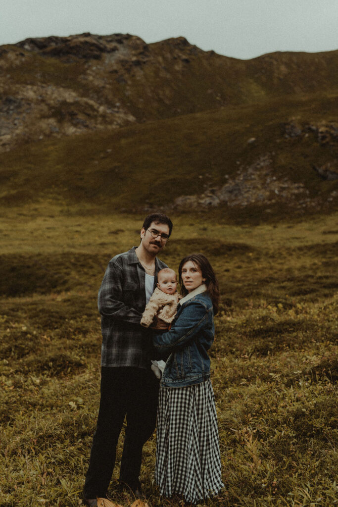 couple looking at the camera during their mountain family session