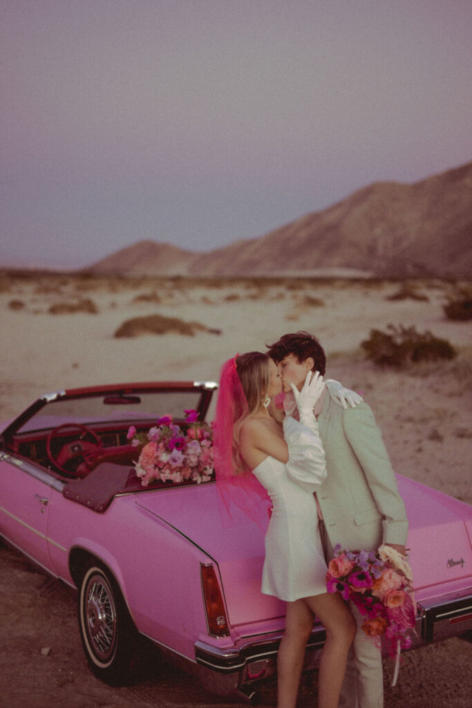 couple kissing at their vibrant elopement