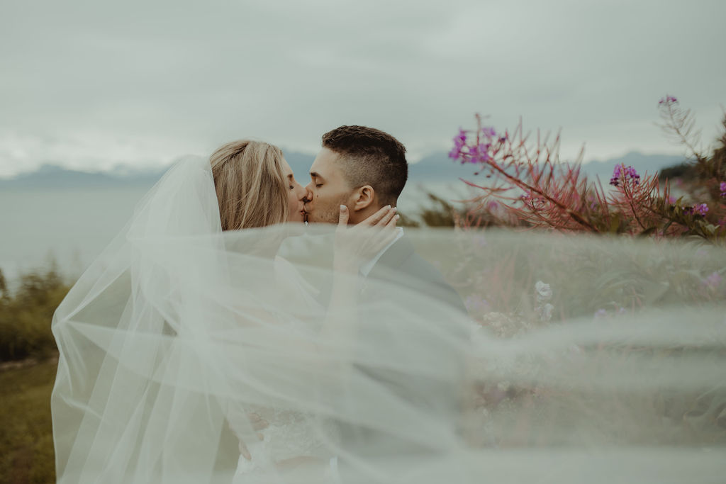 Planning Your Destination Wedding - bride and groom kissing at their wedding