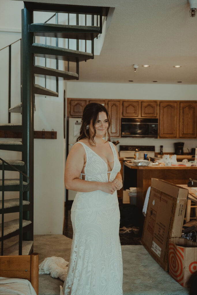 bride at her first look with her bridesmaids