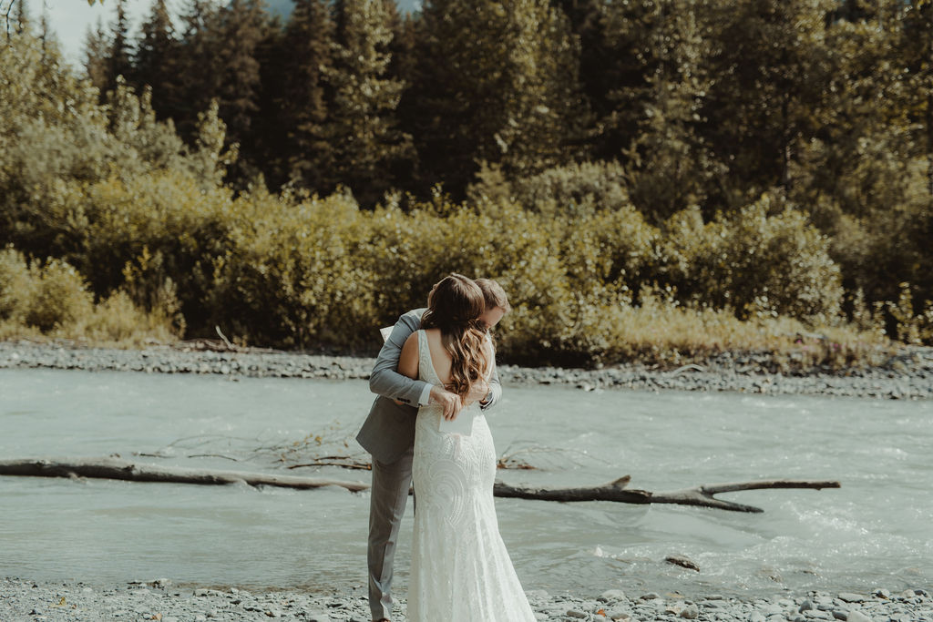 bride and groom hugging during their first look