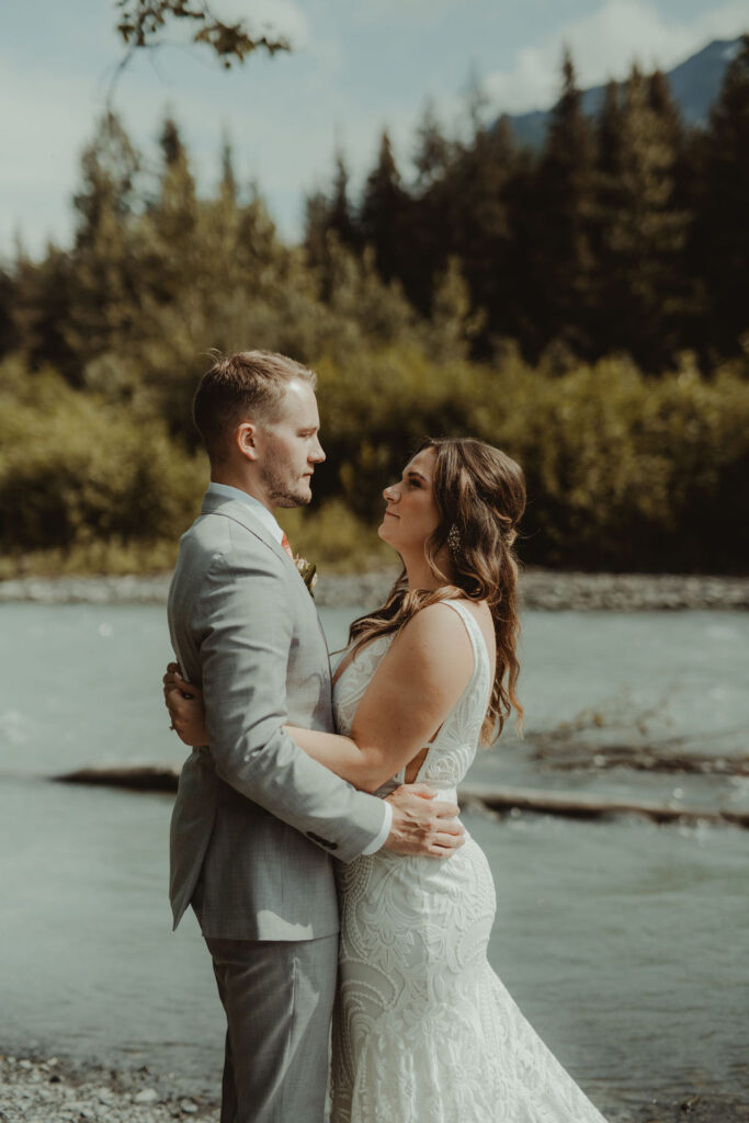 bride and groom hugging 