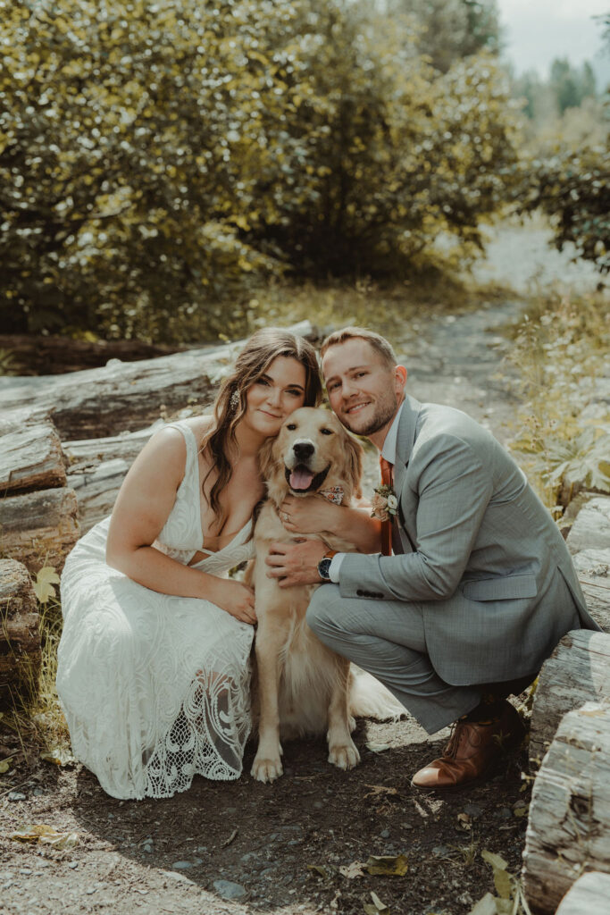 cute portrait of the bride and groom with their dog