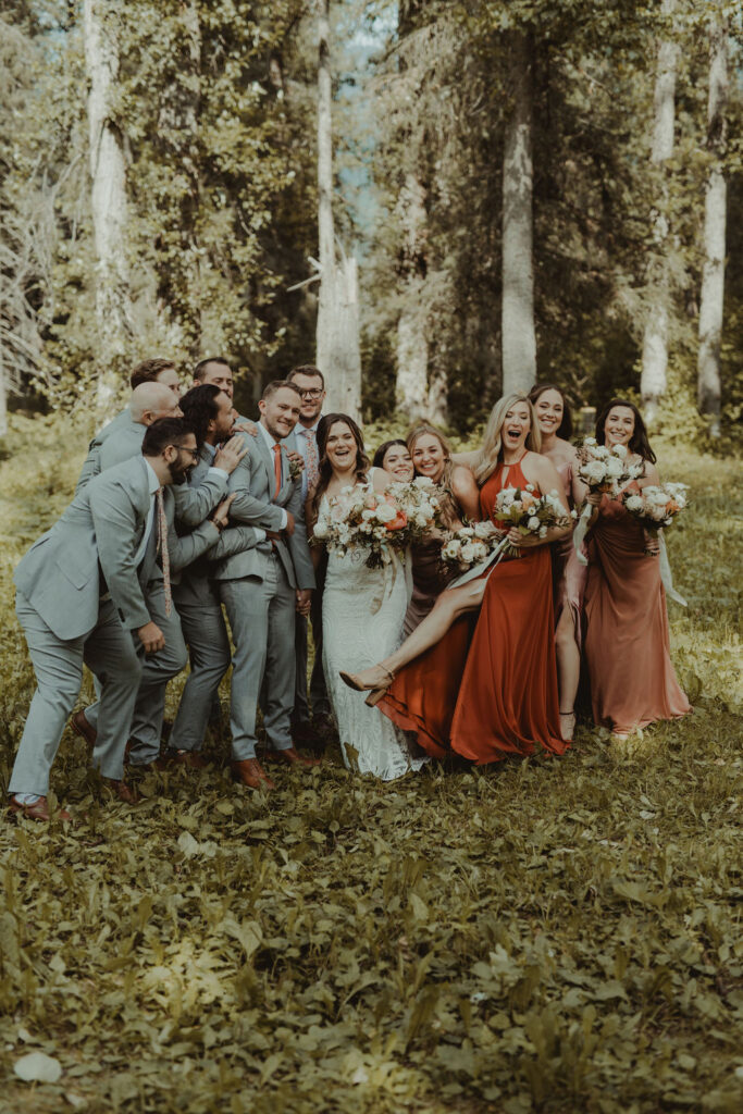 happy couple with their friends at their fun summer wedding