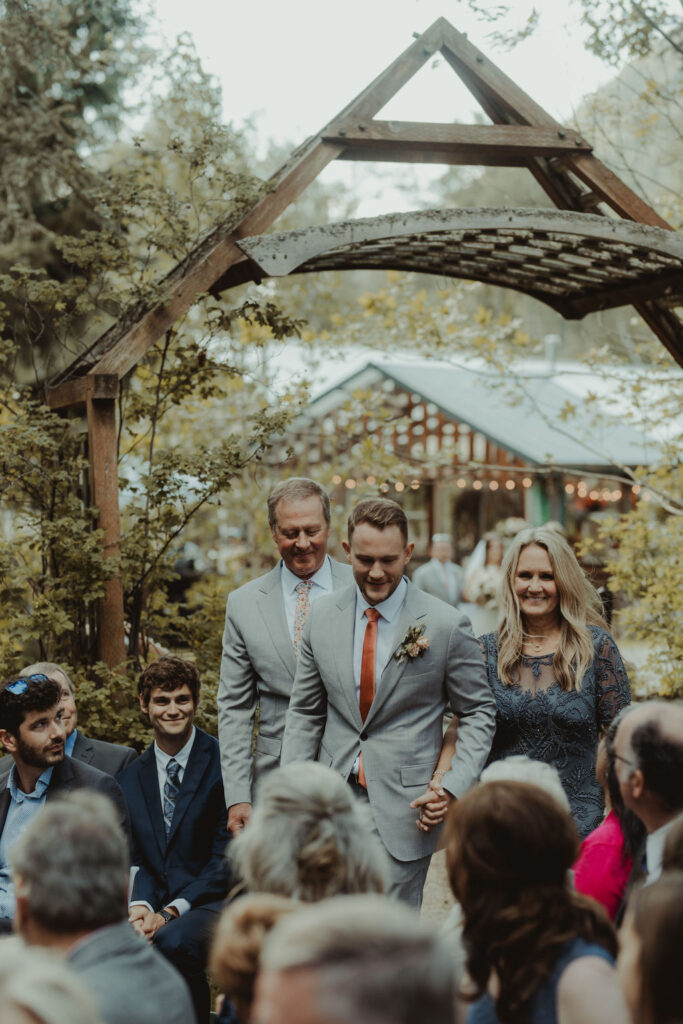 groom walking down the aisle 