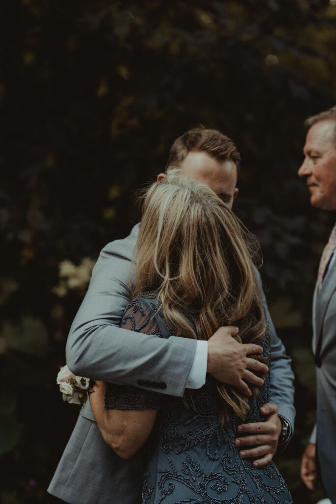 groom hugging his mom