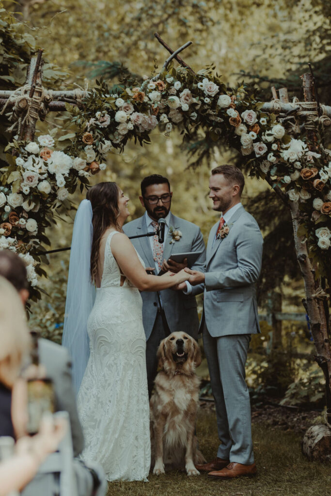 bride and groom holding hands at their wedding ceremony