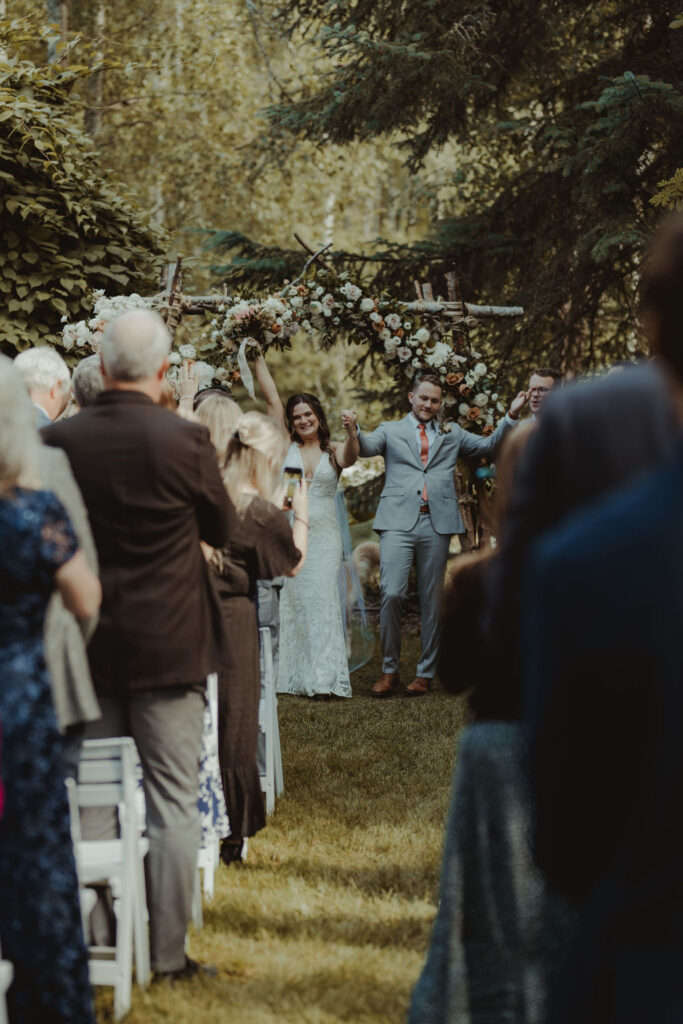 bride and groom heading to their wedding reception