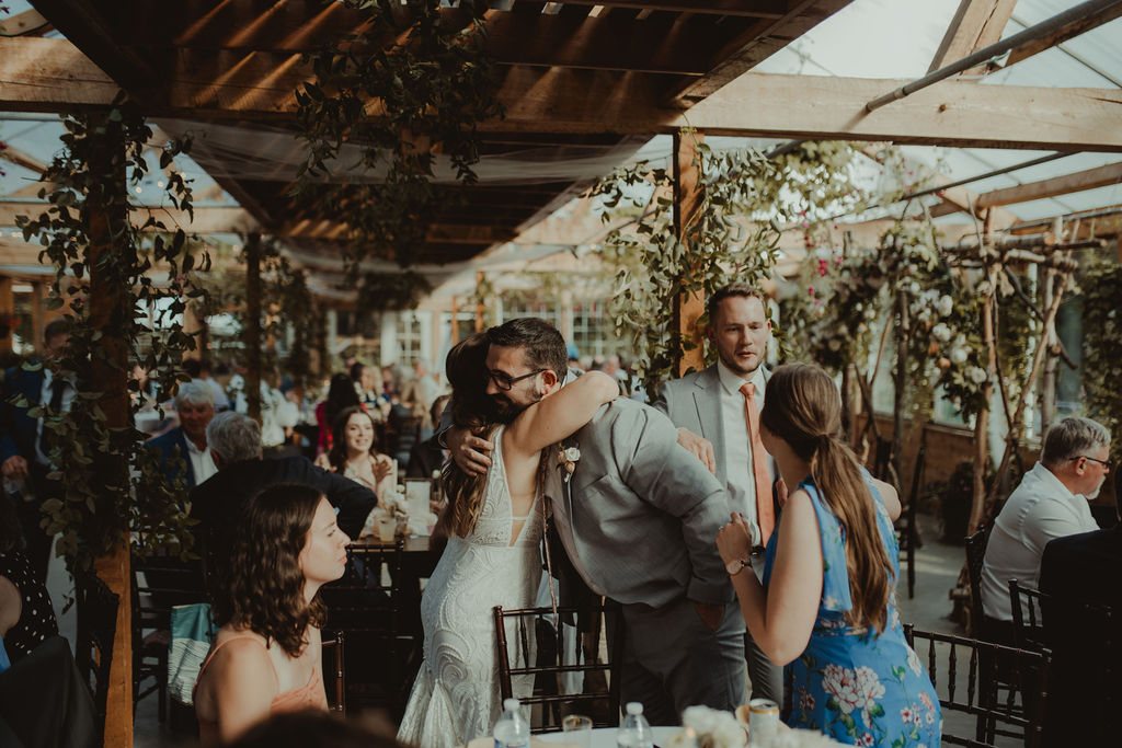 bride hugging with their wedding guests