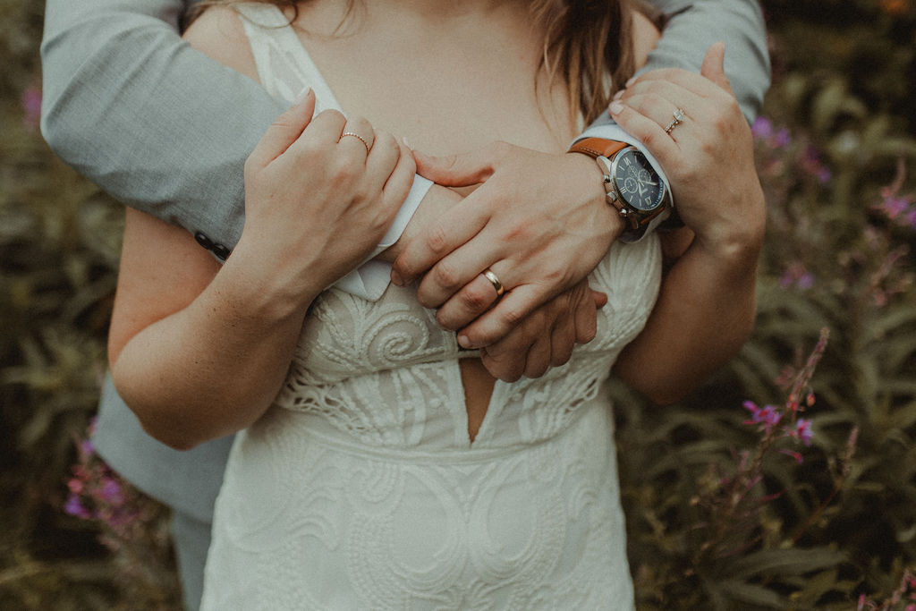 cute couple hugging at their fun summer wedding