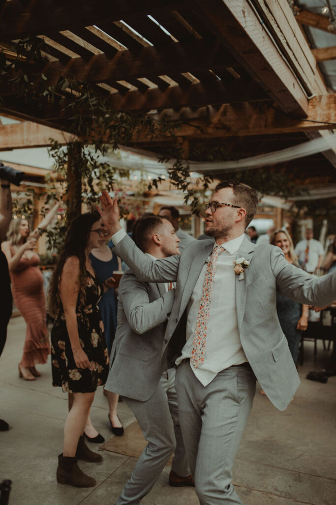 guests dancing at their wedding reception