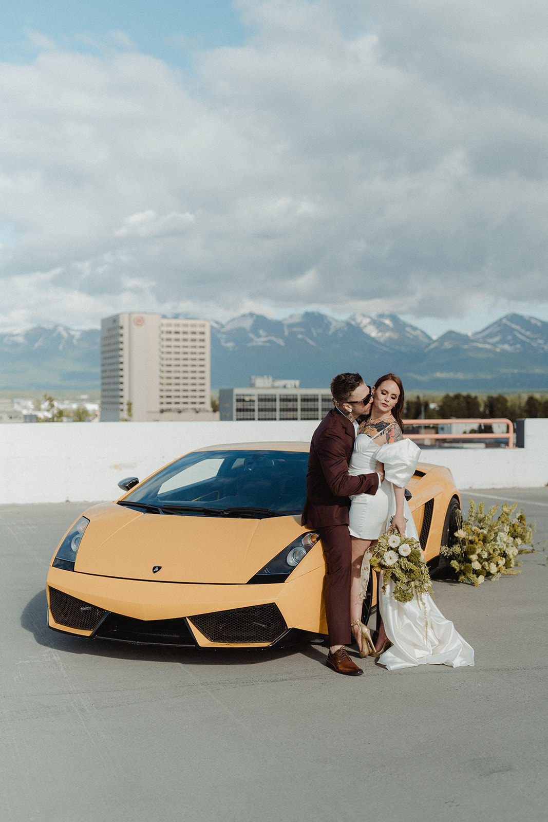 groom kissing the bride on the cheek