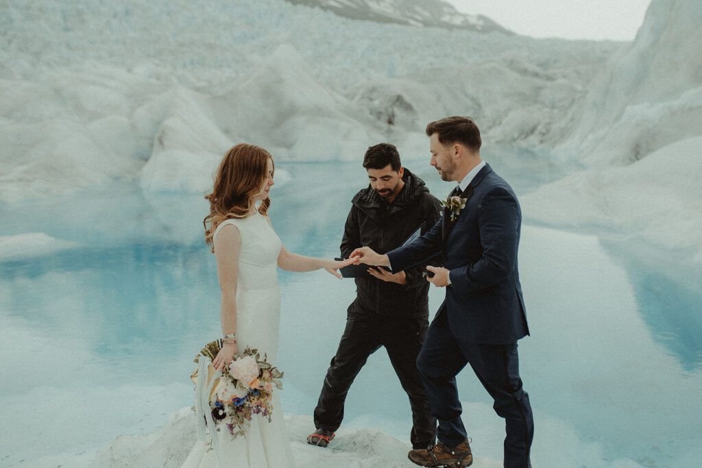 bride and groom exchanging their wedding rings