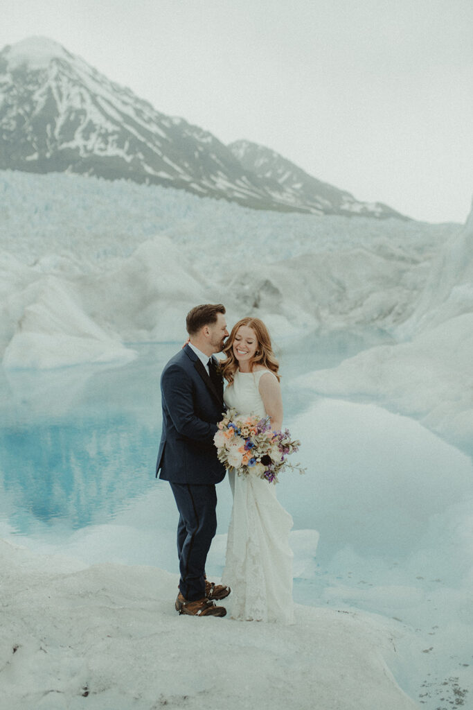 groom kissing the bride on the cheek