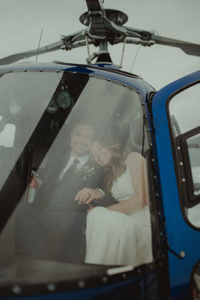 bride and groom at their helicopter ride 