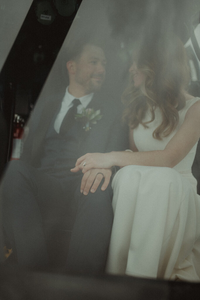 bride and groom looking at each other - add a helicopter to your alaska elopement 