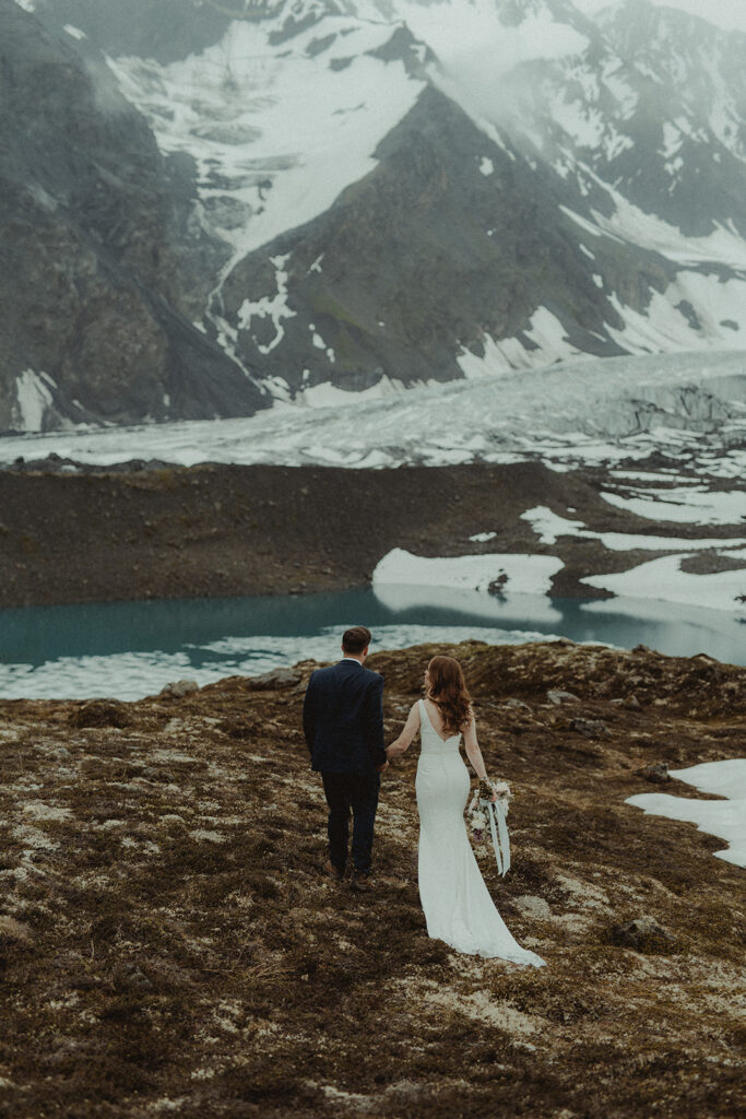 bride and groom holding hands 