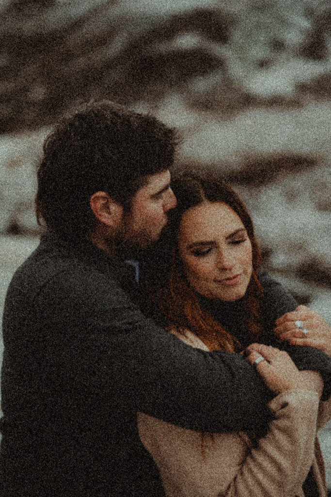 couple hugging during their winter photoshoot