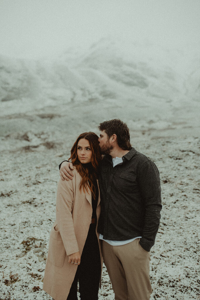 boyfriend kissing his girlfriend on the head