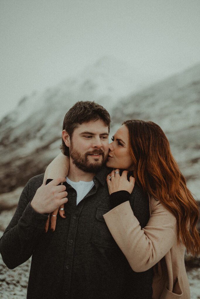 girlfriend kissing her boyfriend on the cheek