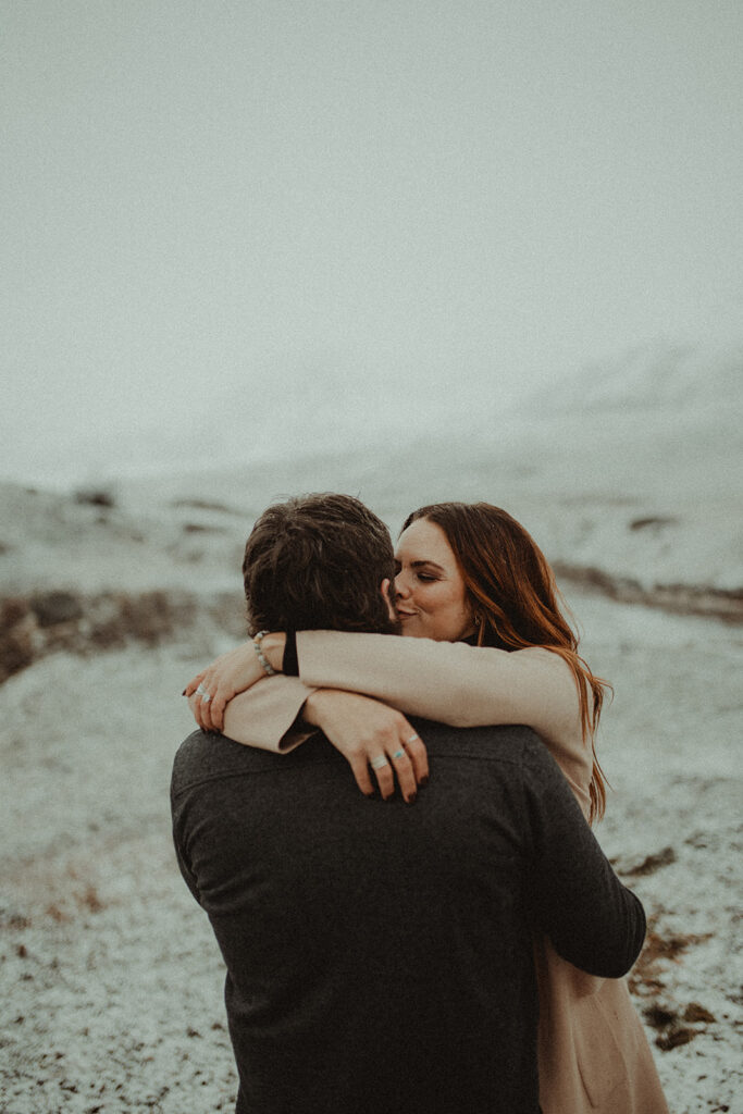 cute couple kissing during their winter couples shoot