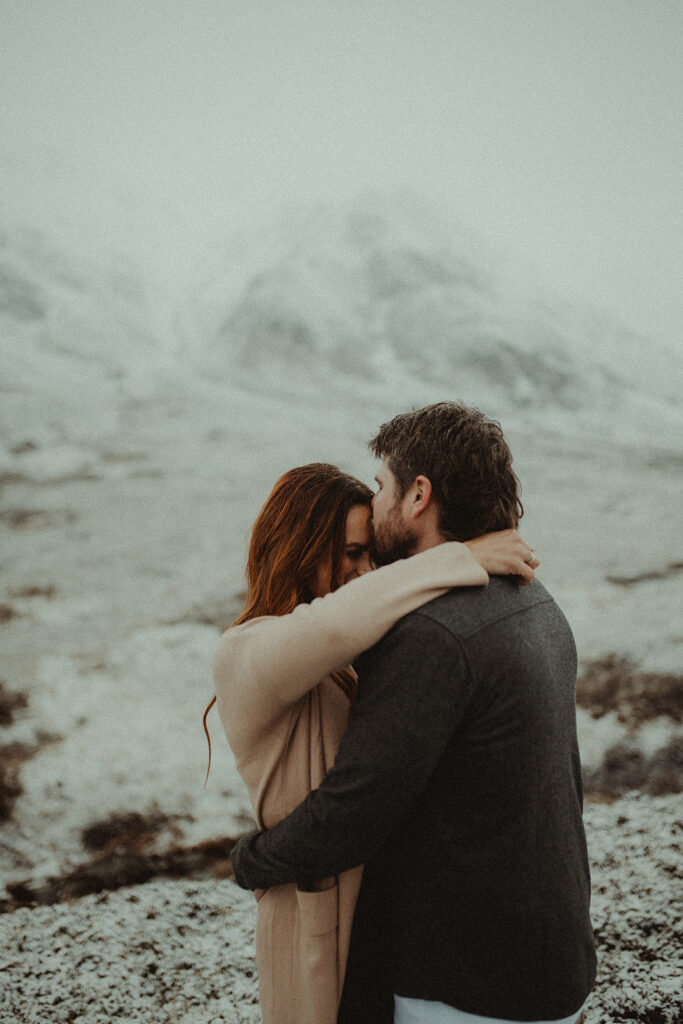 boyfriend kissing his girlfriend on the forehead 