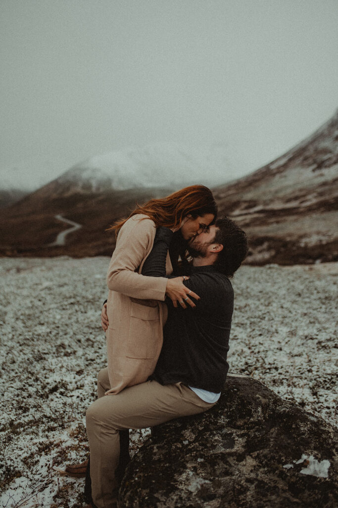 couple kissing during their winter photoshoot