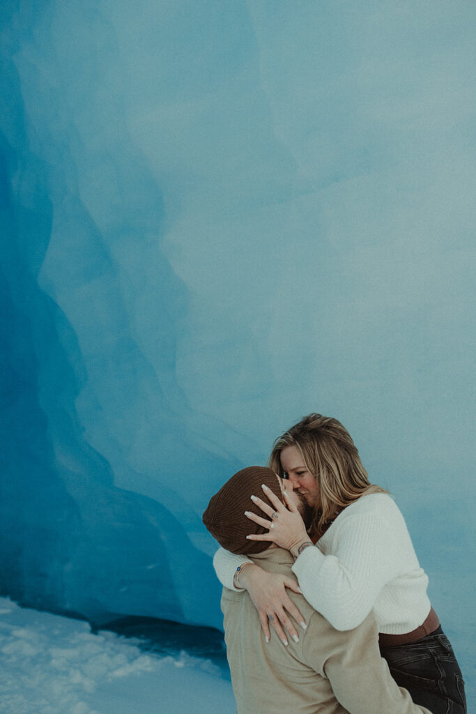 happy newly engaged couple kissing