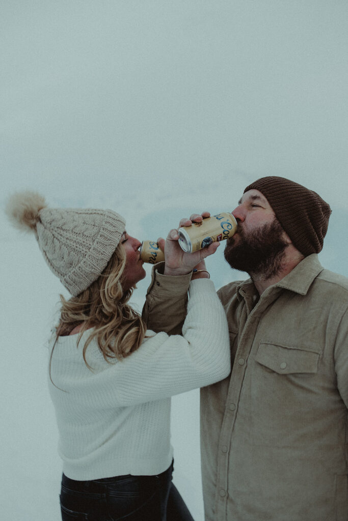 couple drinking a soda during their photoshoot