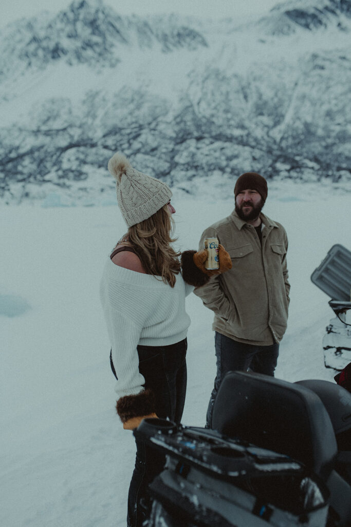 couple talking during their winter engagement session