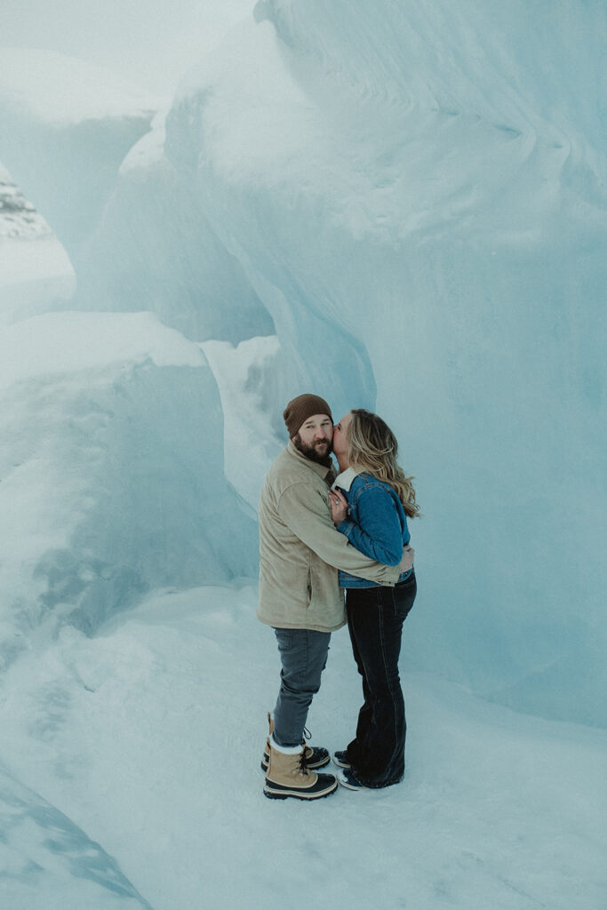 fiance kissing her fiance on the cheek