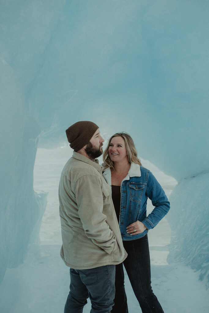 couple laughing with each other during their photoshoot 