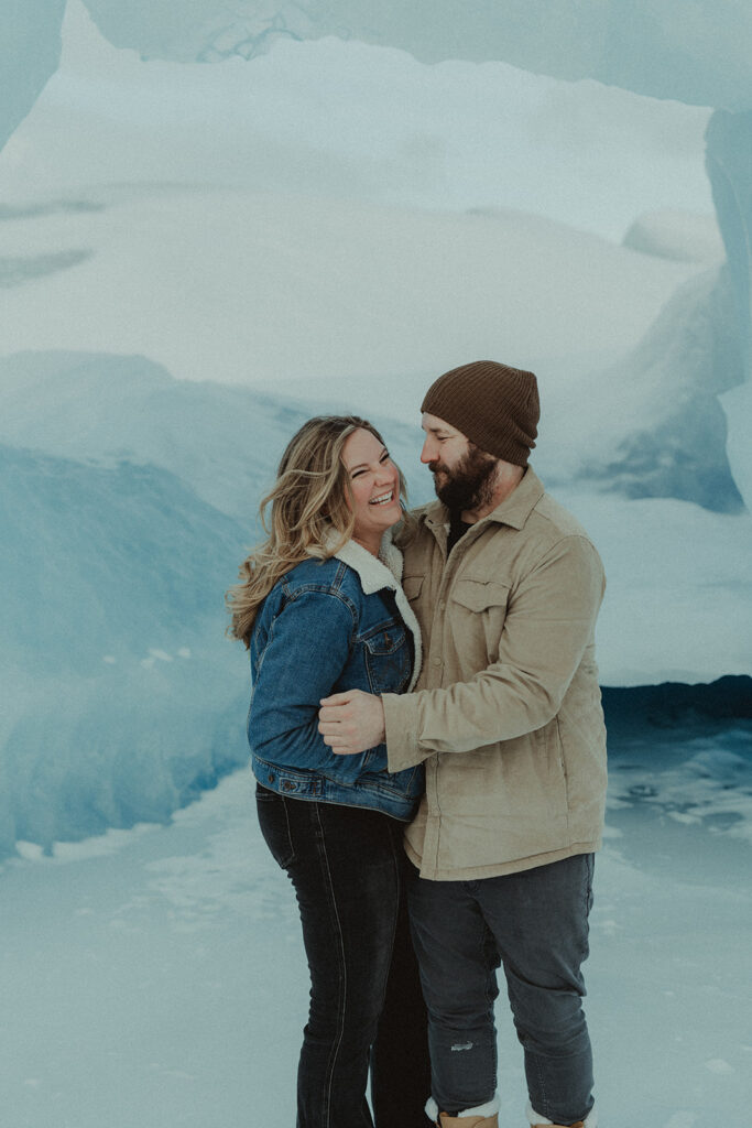 couple laughing with each other during their photoshoot 